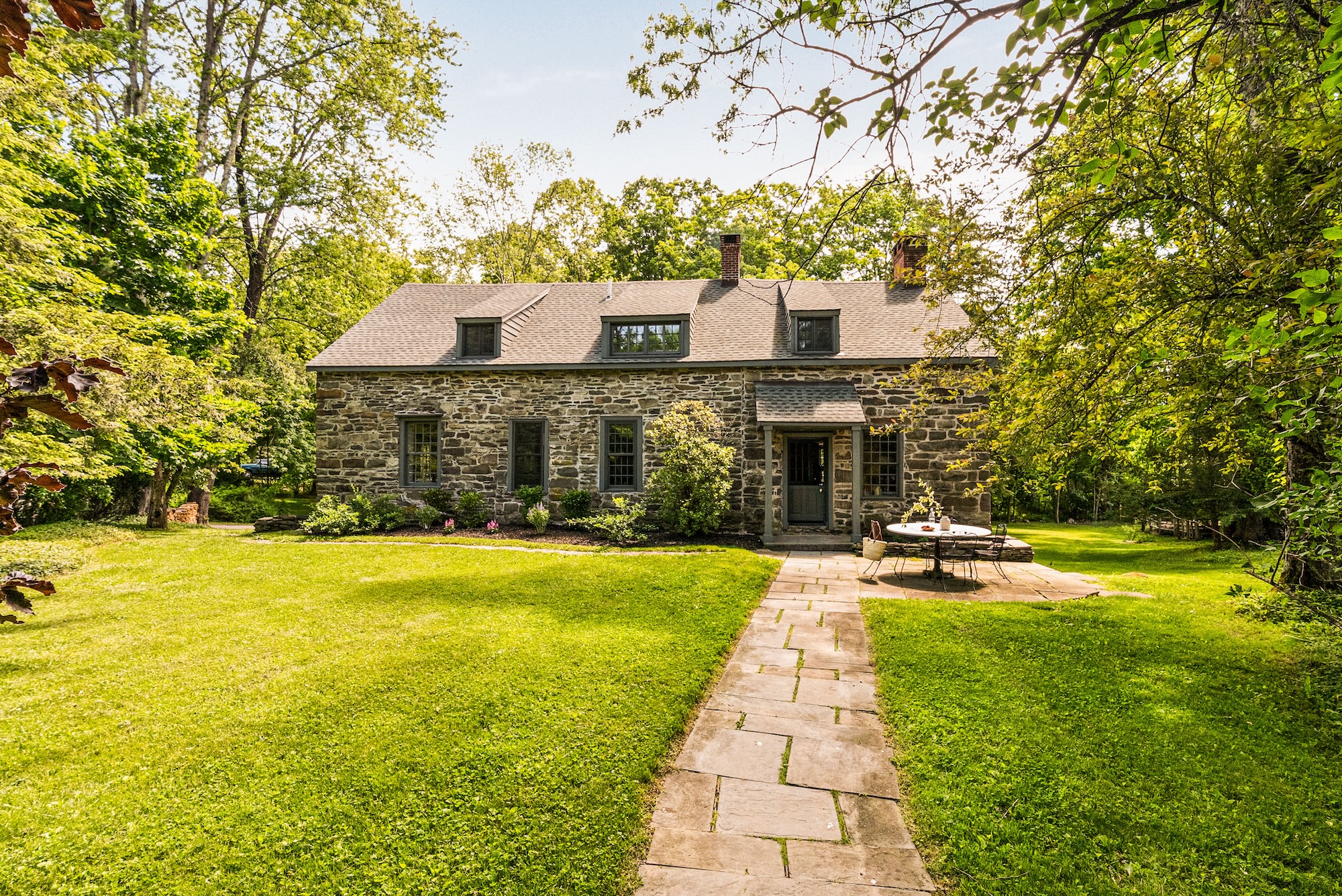 Hudson Valley 1750s stone house with a waterfall on the grounds asks $1.5M