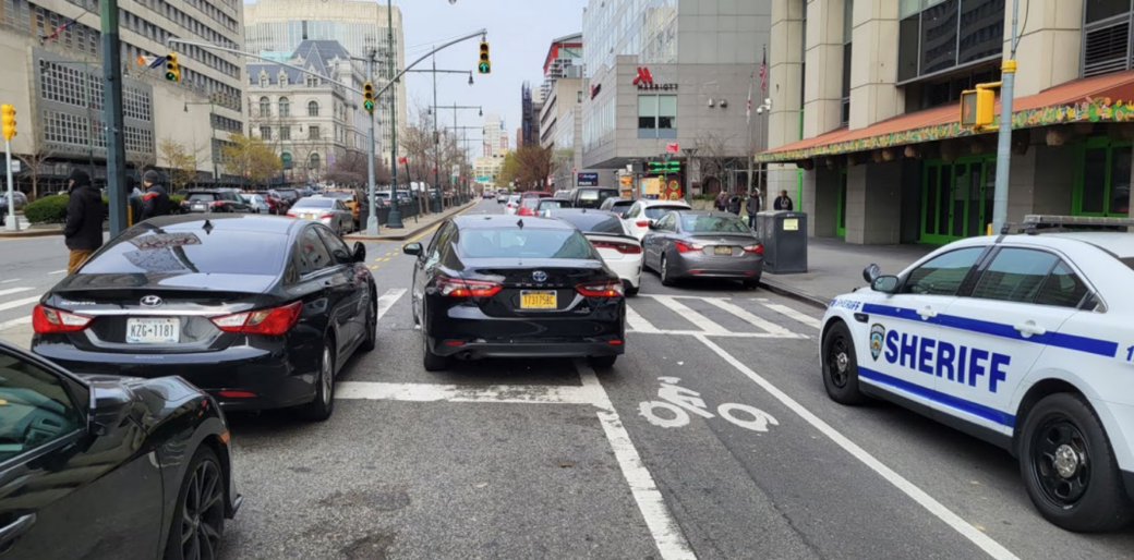 Protected bike lane coming to Adams Street near Brooklyn Bridge to curb illegal parking
