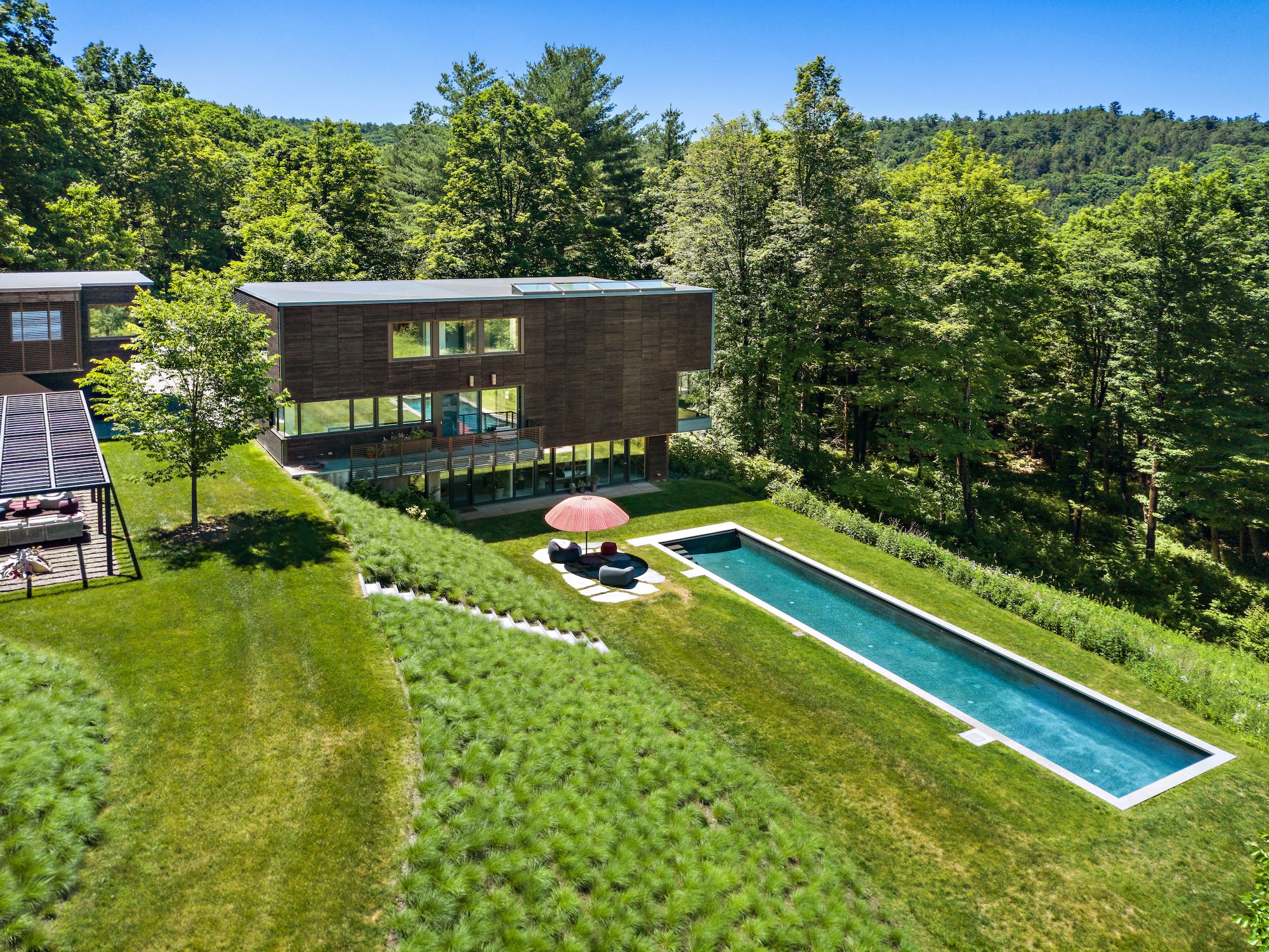 This $4.6M upstate New York property is a modern woodland sanctuary